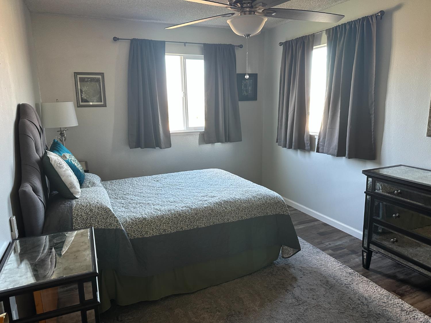 6186 Arena Way Livingston, CA 95334 - Photo 8 of 21 a bedroom with a bed and a window