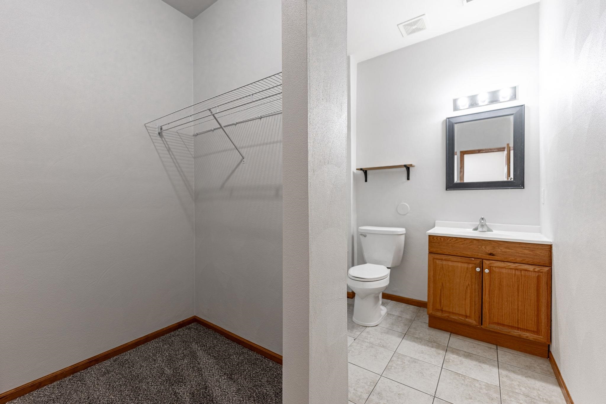 10113 Monarch Road Roscoe, IL 61073 - Photo 14 of 20 a bathroom with a toilet sink and vanity