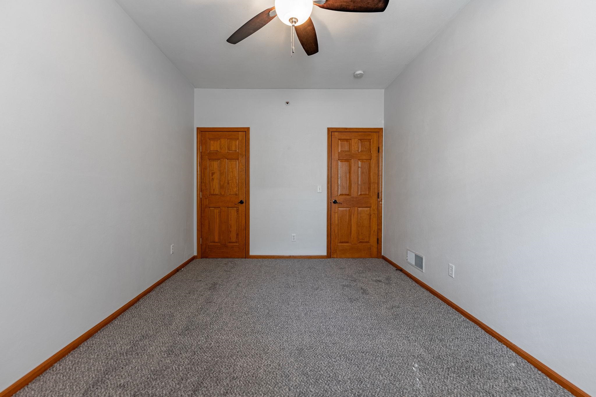10113 Monarch Road Roscoe, IL 61073 - Photo 18 of 20 an empty room with chandelier fan