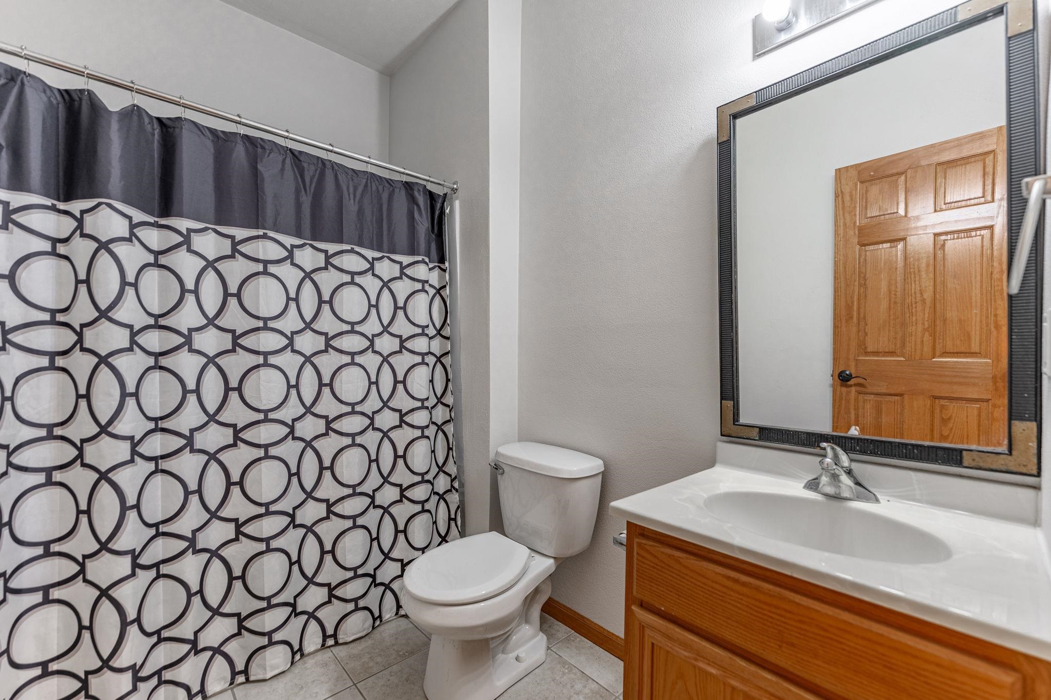 10113 Monarch Road Roscoe, IL 61073 - Photo 20 of 20 a bathroom with a sink and a toilet
