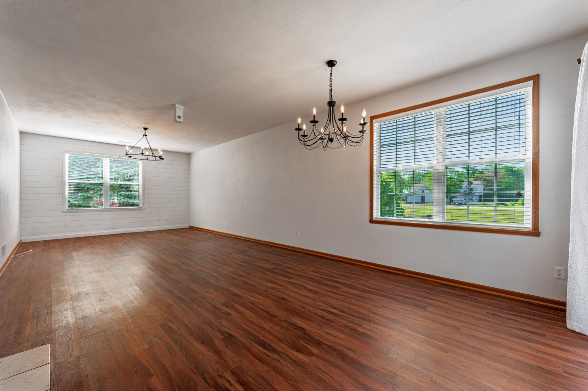 10113 Monarch Road Roscoe, IL 61073 - Photo 5 of 20 an empty room with wooden floor and windows