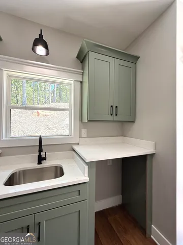 a bathroom with a sink and a window