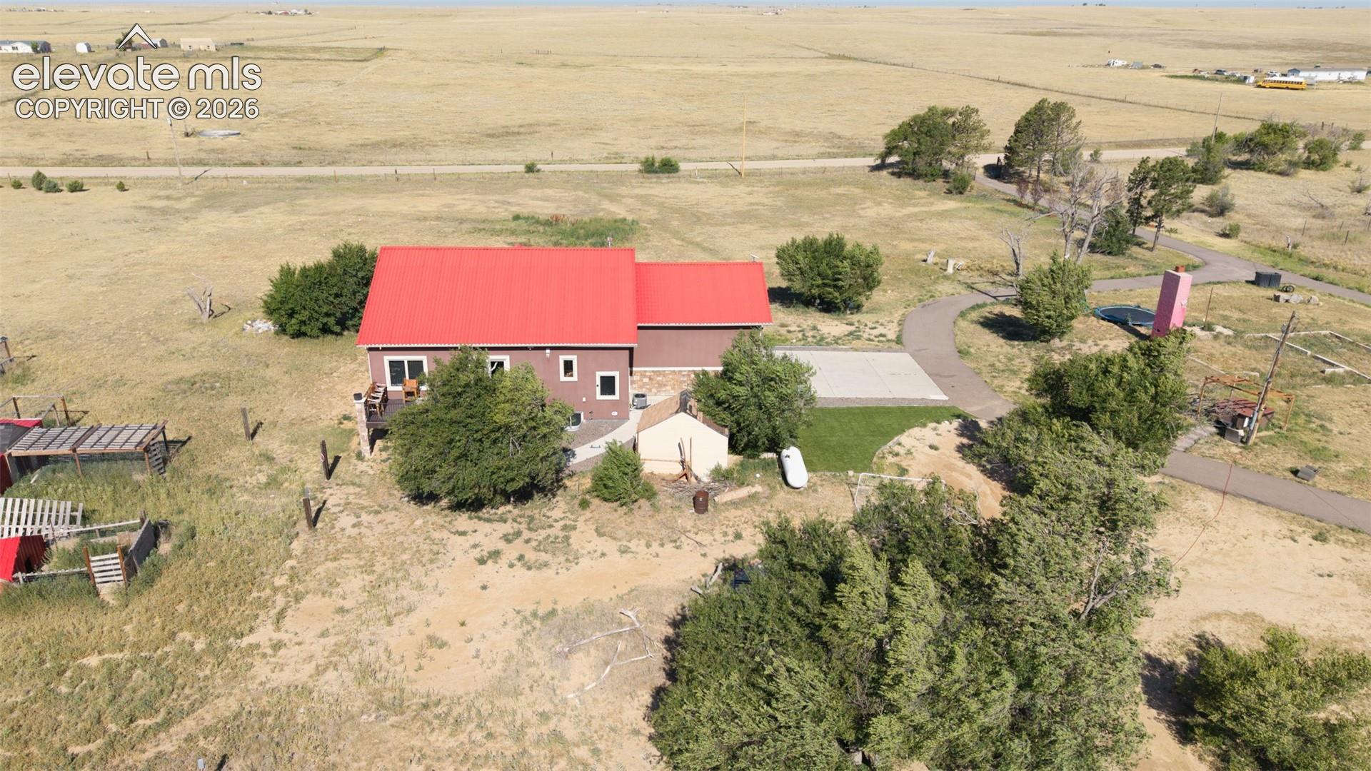 8450 Edison Road Yoder, CO 80864 - Photo 47 of 50 an aerial view of residential houses with outdoor space