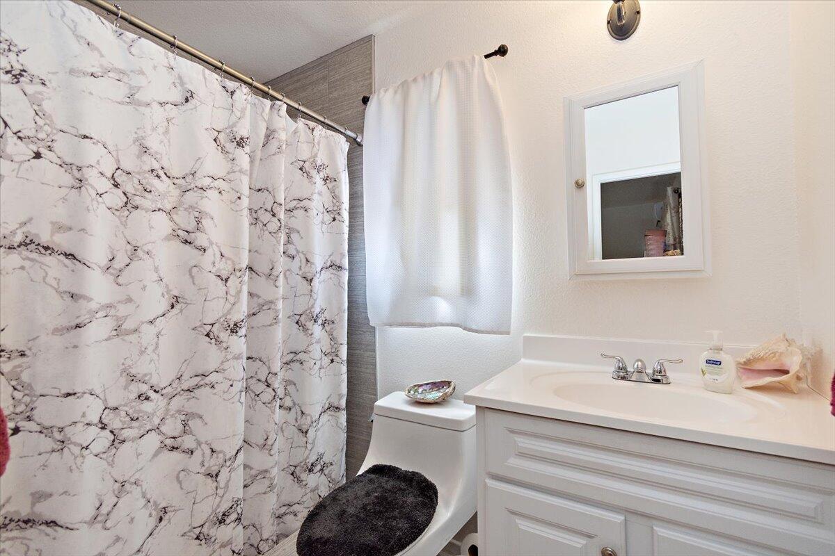 51884 Ida Avenue Cabazon, CA 92230 - Photo 11 of 25 a bathroom with a sink and a toilet