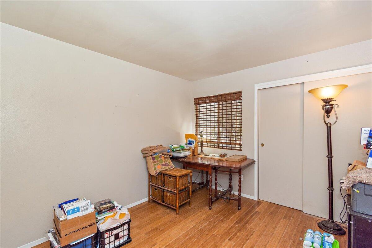 51884 Ida Avenue Cabazon, CA 92230 - Photo 12 of 25 a view of a workspace with furniture and wooden floor