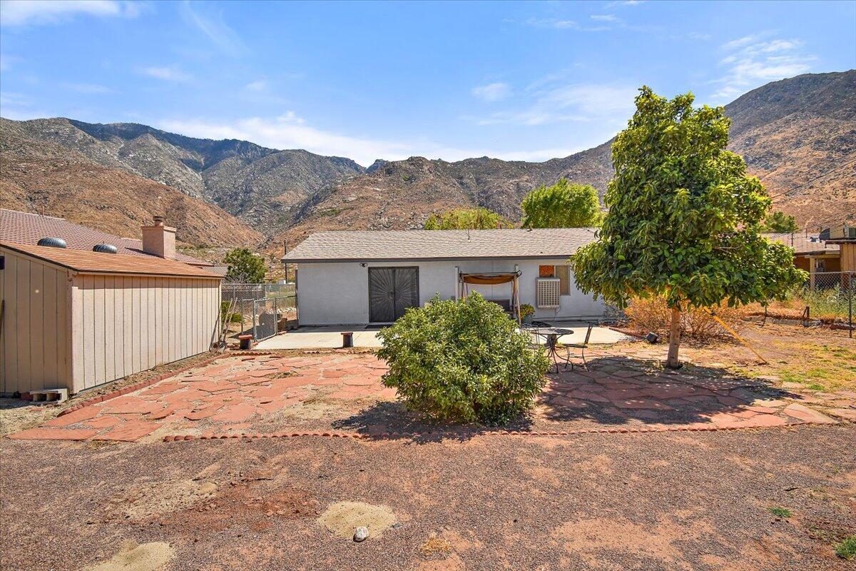 51884 Ida Avenue Cabazon, CA 92230 - Photo 18 of 25 a view of a house with a tree in front of it