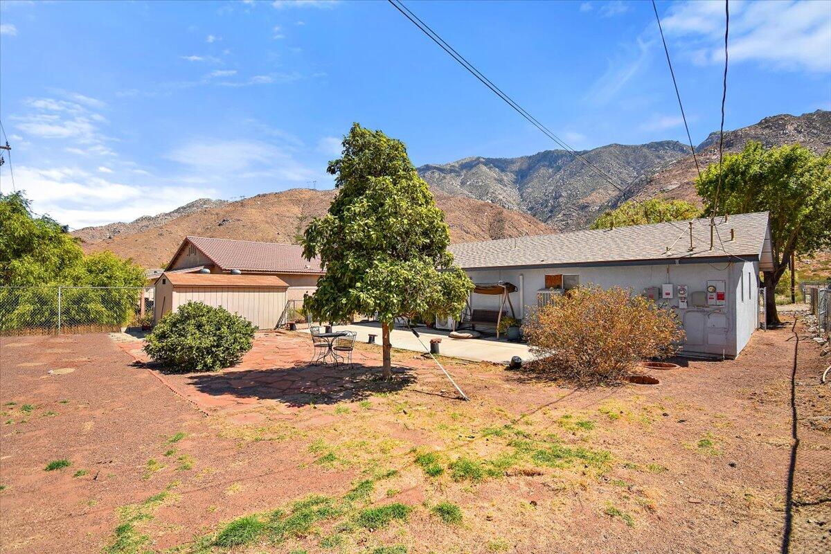 51884 Ida Avenue Cabazon, CA 92230 - Photo 20 of 25 a view of a house with a yard