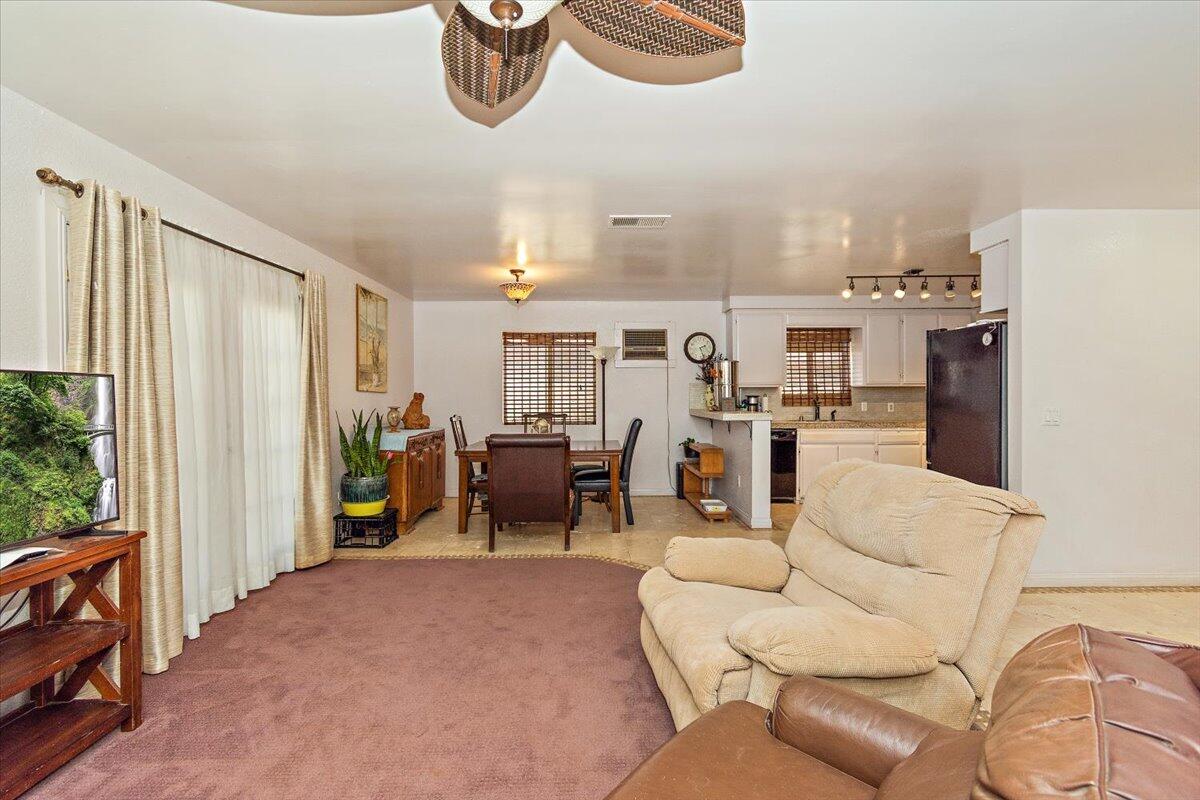 51884 Ida Avenue Cabazon, CA 92230 - Photo 2 of 25 a living room with furniture and a large window