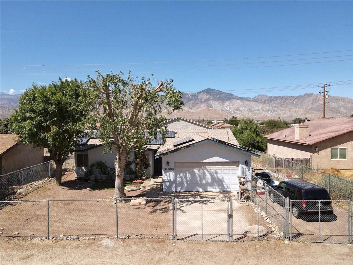 51884 Ida Avenue Cabazon, CA 92230 - Photo 22 of 25 a front view of a house with a yard