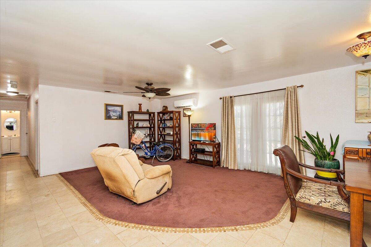51884 Ida Avenue Cabazon, CA 92230 - Photo 3 of 25 a living room with furniture and potted plant