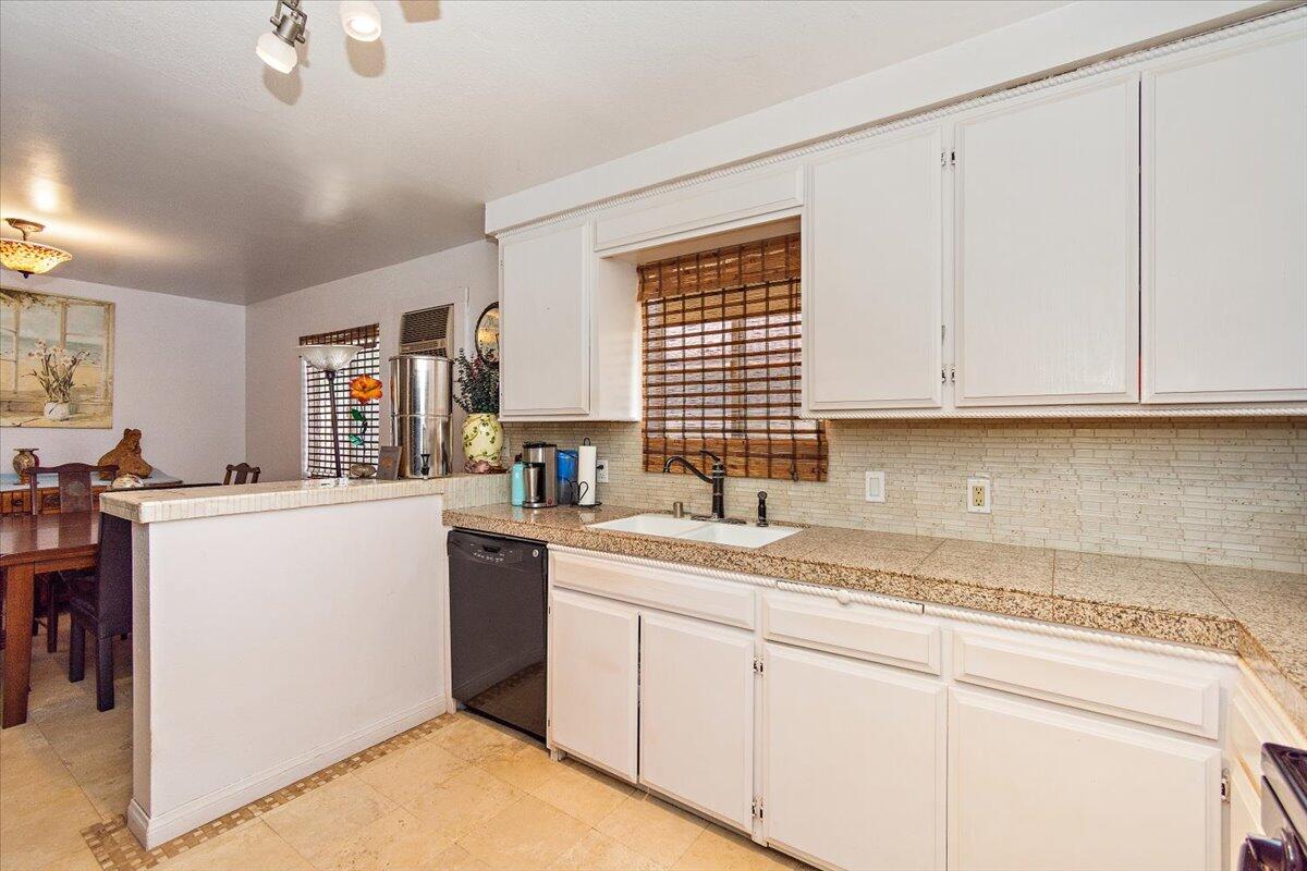 51884 Ida Avenue Cabazon, CA 92230 - Photo 7 of 25 a kitchen with a sink cabinets and window