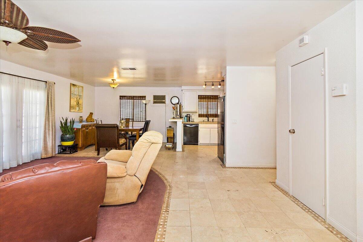 51884 Ida Avenue Cabazon, CA 92230 - Photo 8 of 25 a living room with furniture and kitchen view