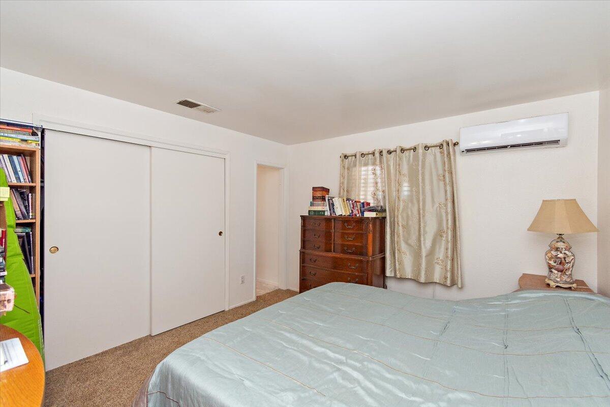 51884 Ida Avenue Cabazon, CA 92230 - Photo 9 of 25 a bedroom with a bed and a closet