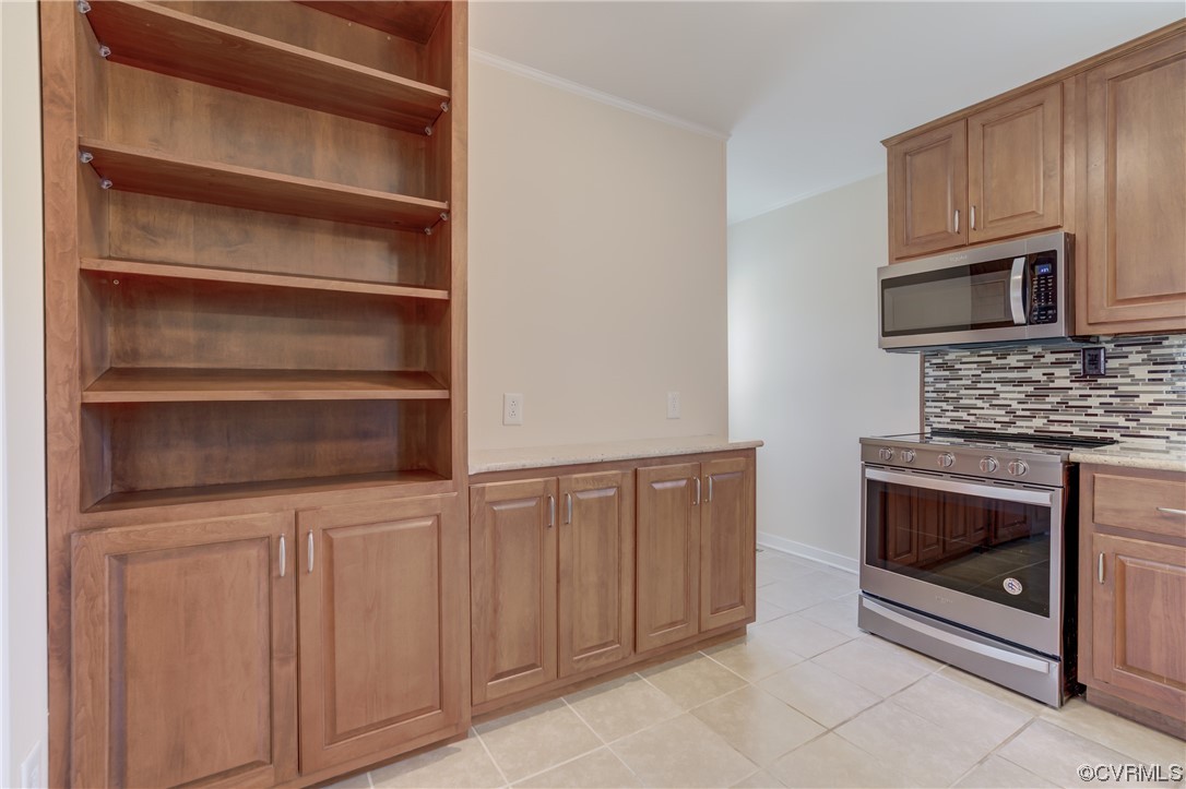 2341 Sheppard Town Road Maidens, VA 23102 - Photo 15 of 45 a kitchen with white cabinets and oven