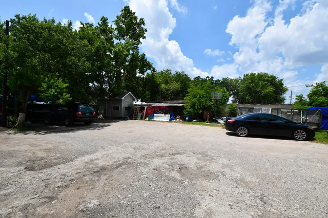a view of street with parked cars