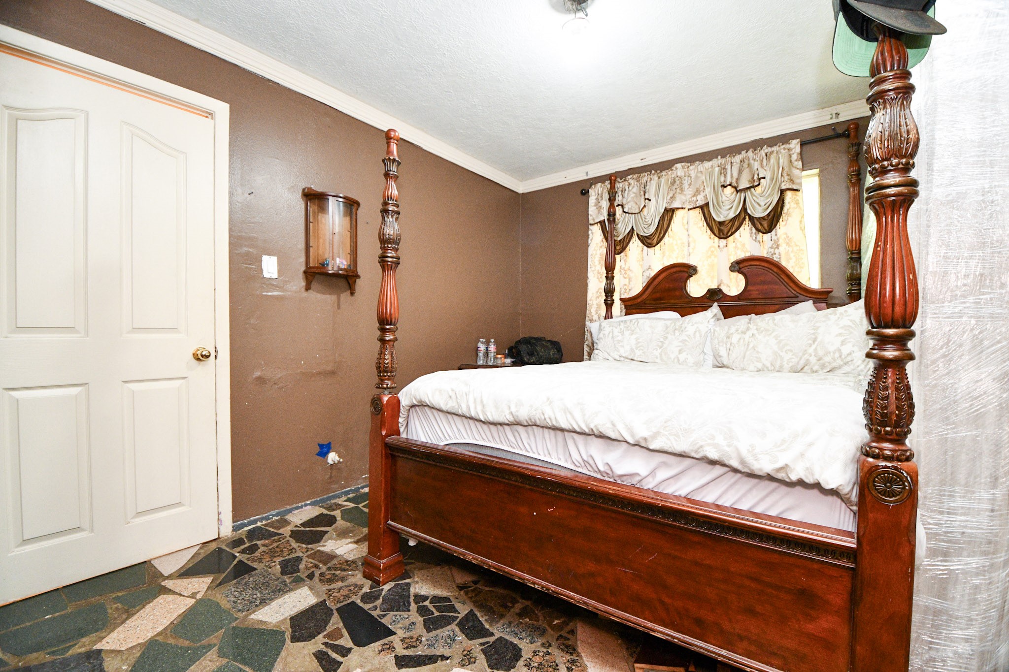 16005 Old Richmond Road Sugar Land, TX 77498 - Photo 19 of 46 a bedroom with a bed and a window