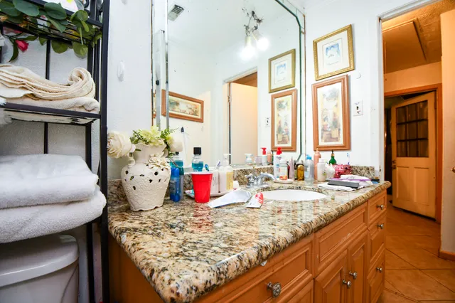 a living room filled with furniture and a large window