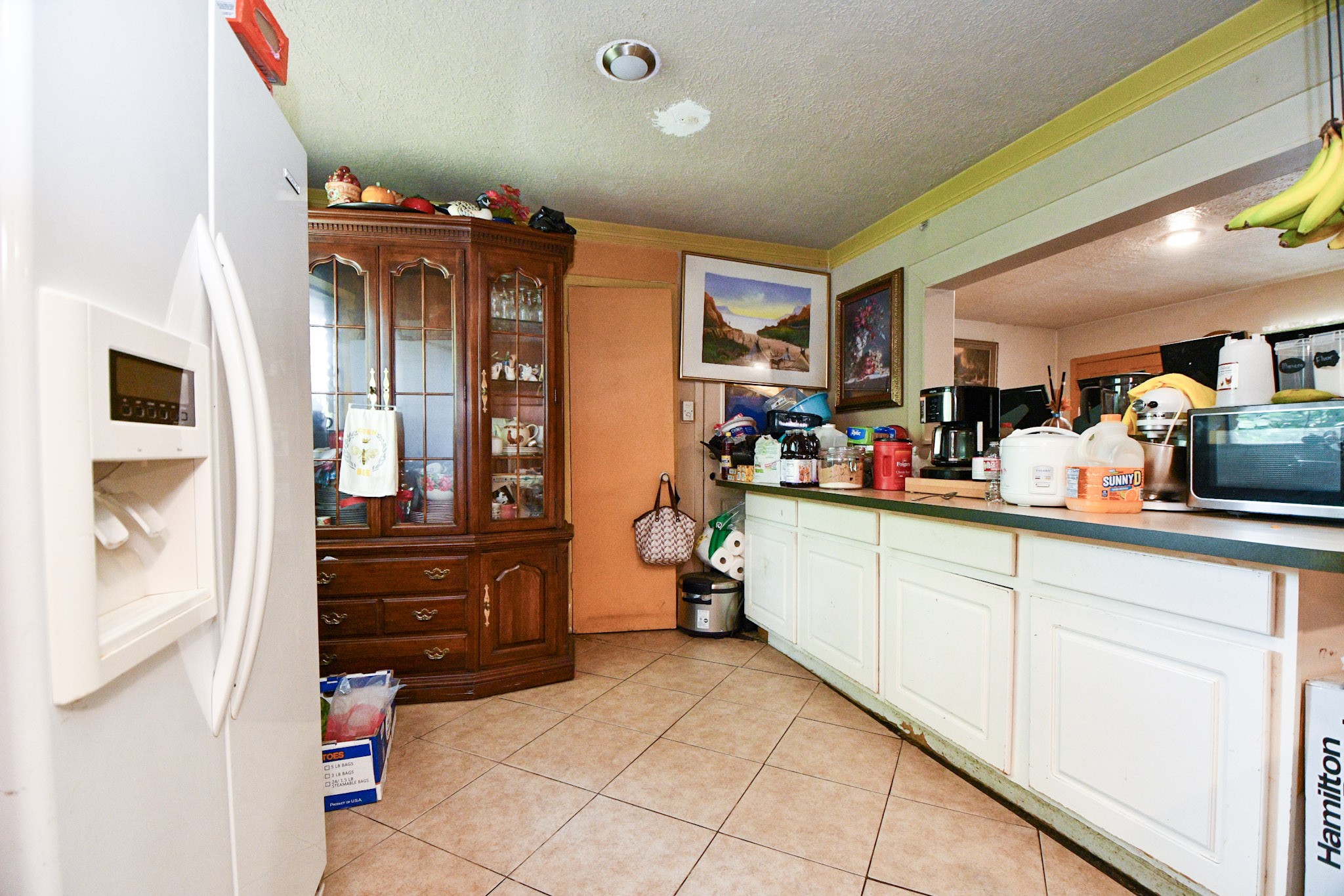 16005 Old Richmond Road Sugar Land, TX 77498 - Photo 25 of 46 a kitchen with a sink and cabinets