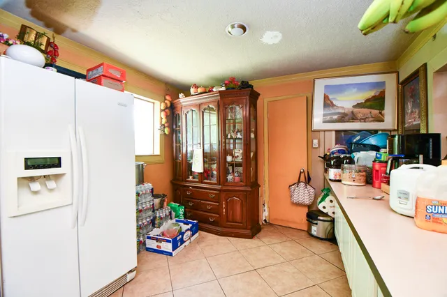 a kitchen with stainless steel appliances a refrigerator and a stove