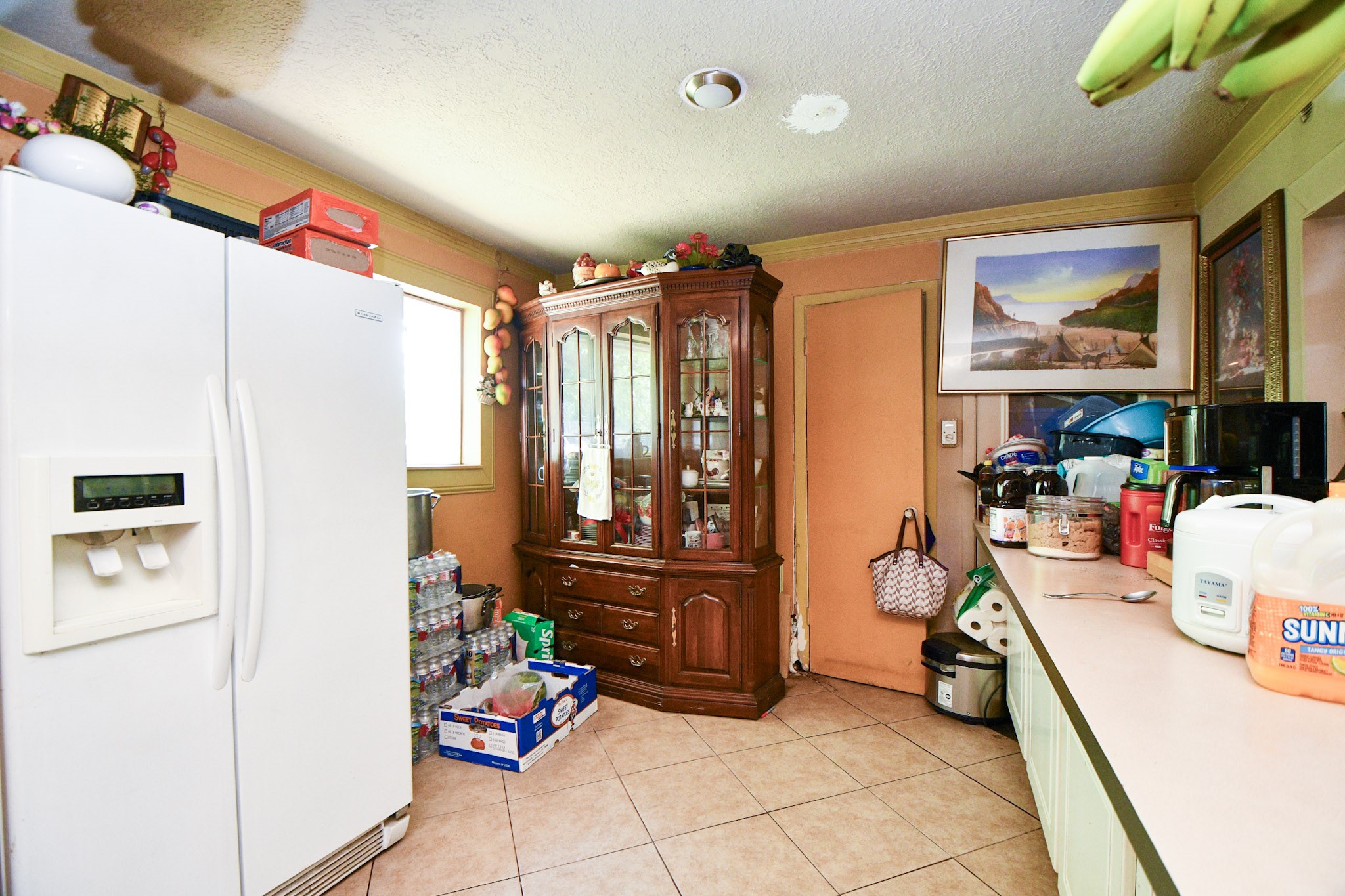 16005 Old Richmond Road Sugar Land, TX 77498 - Photo 26 of 46 a kitchen with stainless steel appliances a refrigerator and a stove