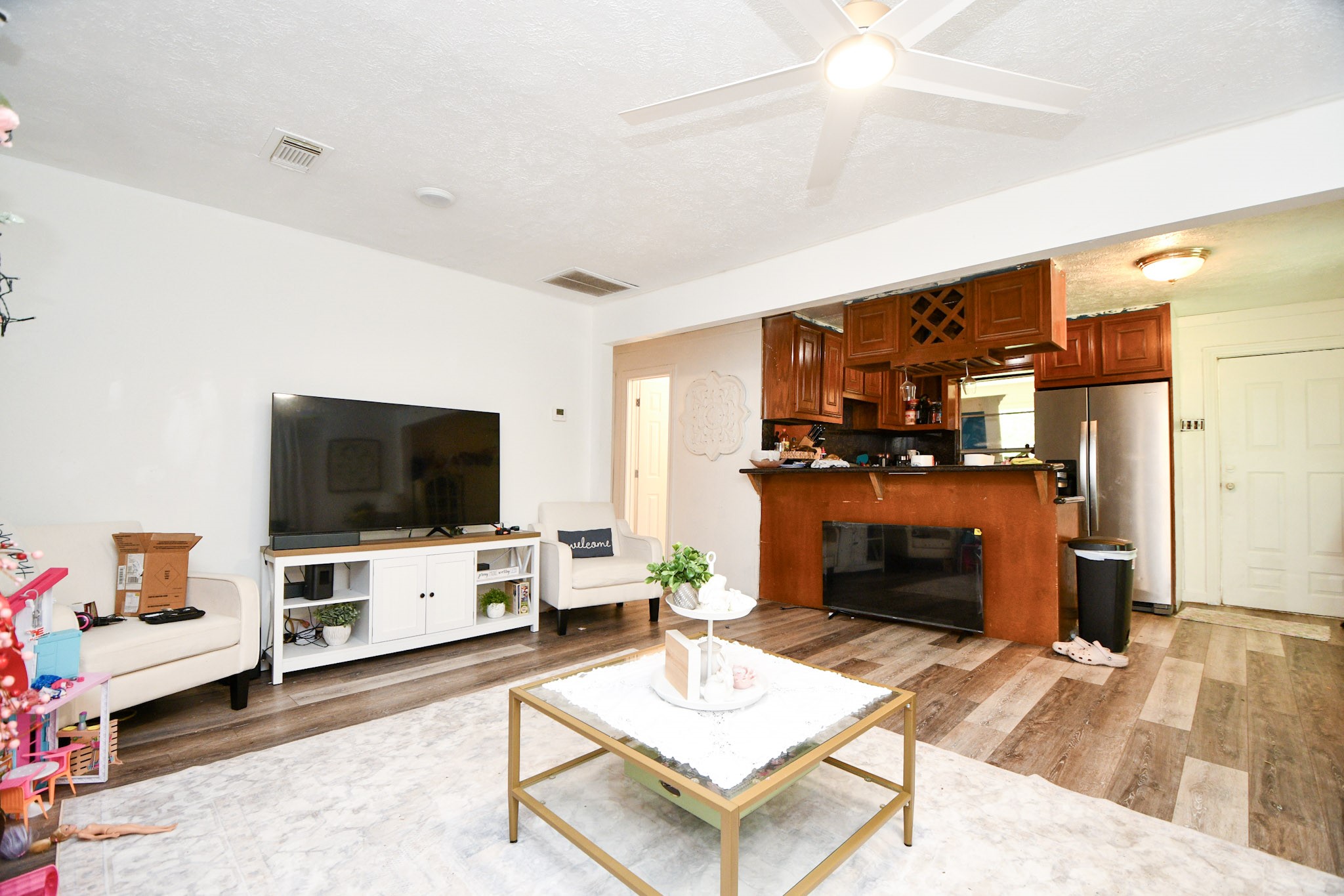 16005 Old Richmond Road Sugar Land, TX 77498 - Photo 30 of 46 a living room with furniture and a flat screen tv