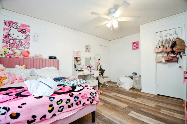 a bedroom with furniture and a chandelier