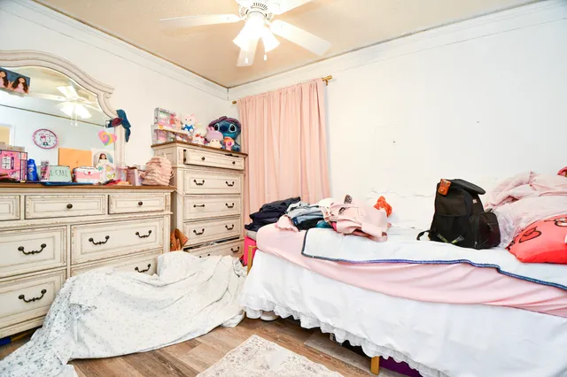 a bed room with a bed and a dresser