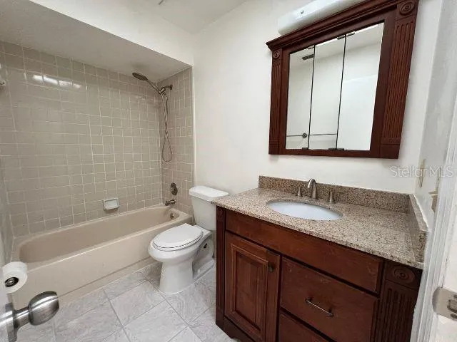a view of a hallway with wooden shelves