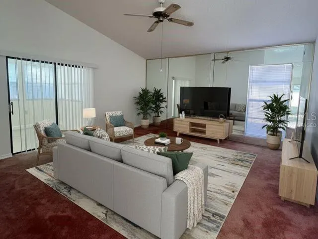 a living room with furniture and a flat screen tv