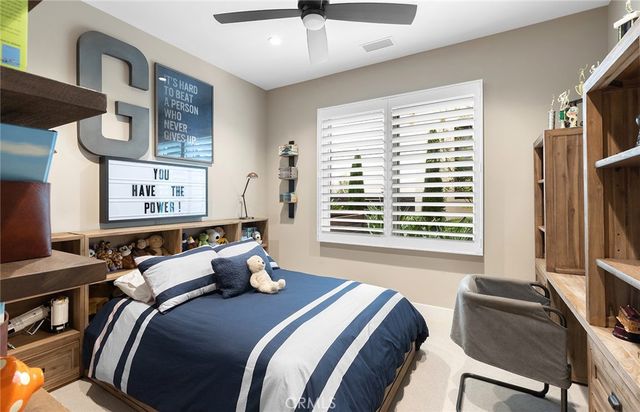 a bedroom with furniture and a window