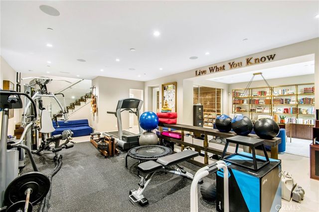 a gym room with lots of gym equipment