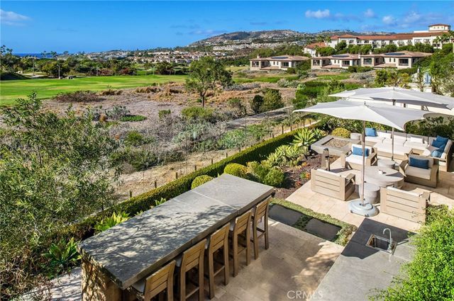 a view of a patio with couches and pool
