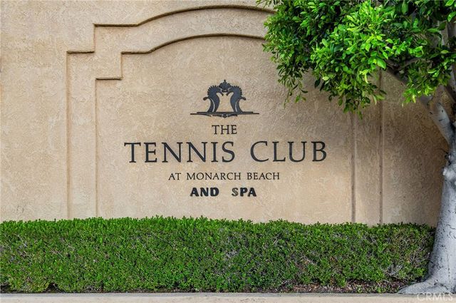 an aerial view of a residential houses with city view