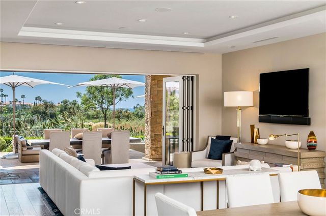 a living room with fireplace furniture and a flat screen tv