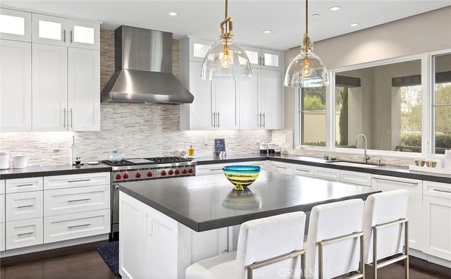 a kitchen that has a lot of cabinets in it