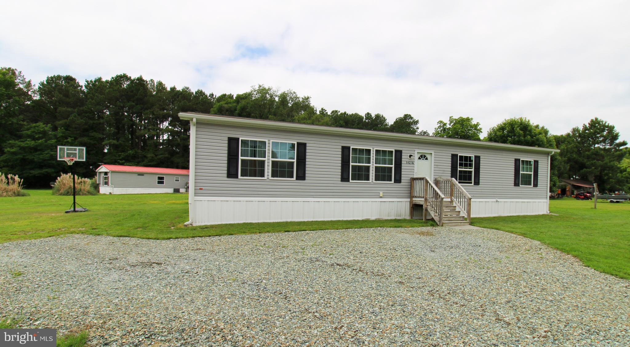 11276 Hodson White Road Deal Island, MD 21821 - Photo 2 of 27 a view of a house with a patio