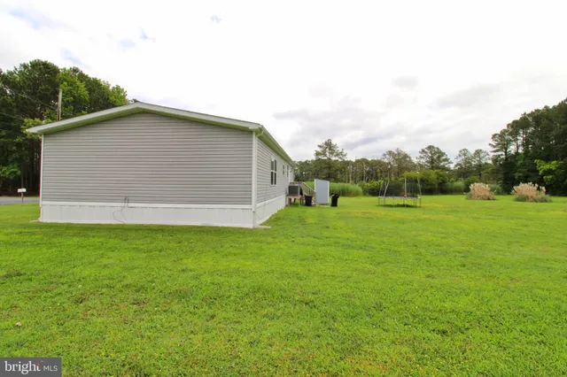 a view of a house with a big yard
