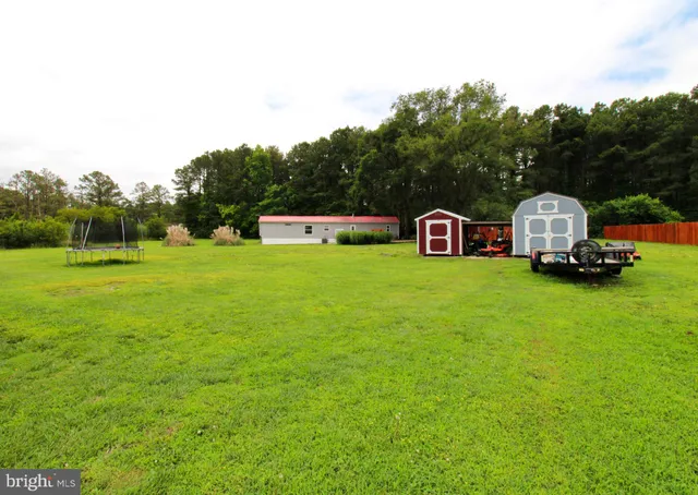 a view of a backyard with sitting area