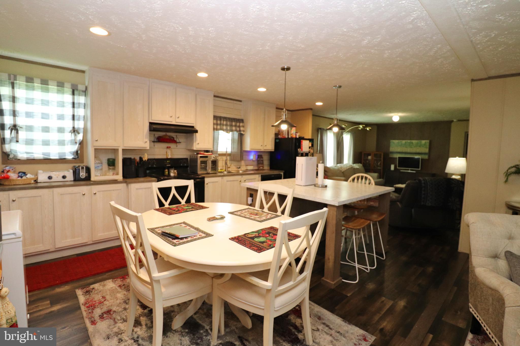 11276 Hodson White Road Deal Island, MD 21821 - Photo 9 of 27 a view of a dining area with furniture