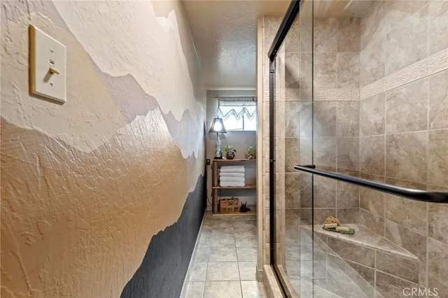 a bathroom with a bathtub and shower