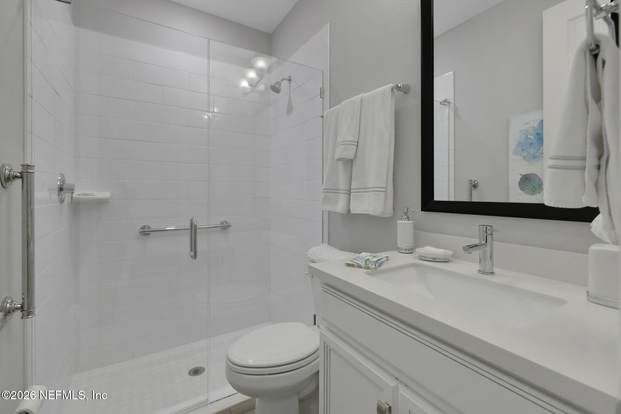 146 Clarendon Road St. Johns, FL 32259 - Photo 38 of 59 a bathroom with a sink a toilet and a mirror