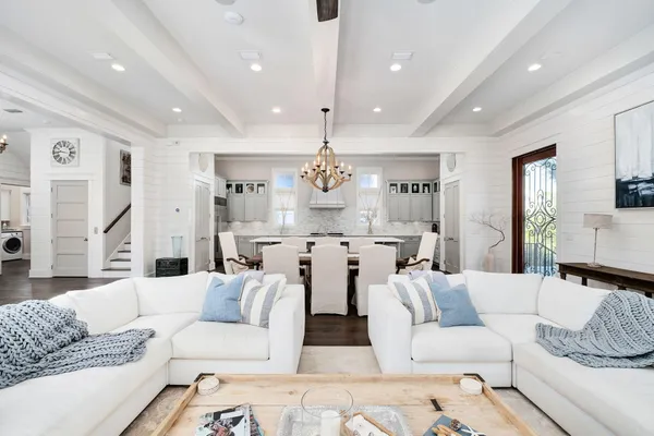 a living room with furniture or kitchen and a chandelier