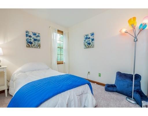 25 Farm Road Stow, MA 01775 - Photo 16 of 22 a bedroom with a bed and a chair