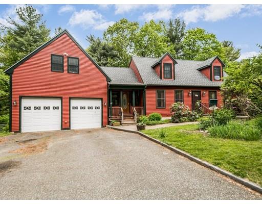 25 Farm Road Stow, MA 01775 - Photo 22 of 22 a front view of a house with a yard and garage