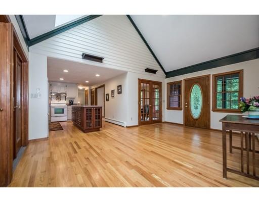 25 Farm Road Stow, MA 01775 - Photo 3 of 22 a view of a livingroom with furniture and a kitchen