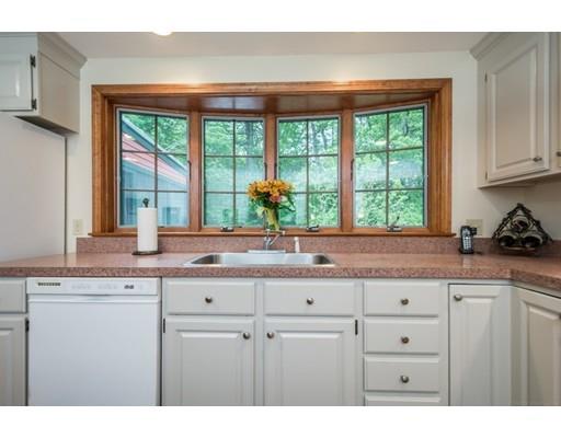 25 Farm Road Stow, MA 01775 - Photo 6 of 22 a kitchen with stainless steel appliances white cabinets and a window