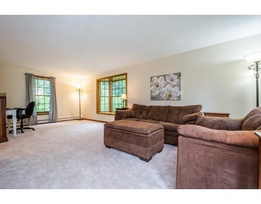 25 Farm Road Stow, MA 01775 - Photo 9 of 22 a living room with furniture and a large window