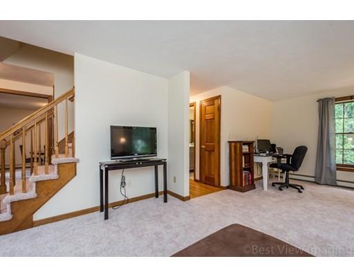 25 Farm Road Stow, MA 01775 - Photo 10 of 22 a living room with furniture and a flat screen tv