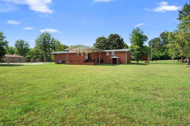 a view of a house with a big yard
