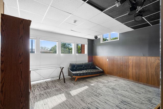 a living room with furniture and a rug